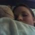 Someoen sleeping with American Football.