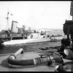 HMS Edinburgh getting supplies at the Kola Inlet 1942.