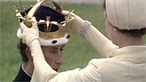 Queen Elizabeth crowns her son the Prince of Wales.
