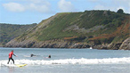 Surfing at Caswell Bay by GSD