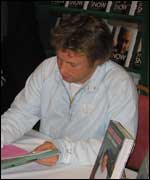 Jamie signing his new book