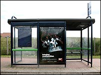 Poster on display on a bus shelter