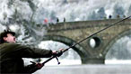 Man fishing near bridge