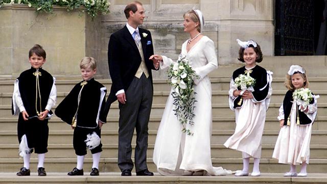 Prince Edward, his wife Sophie Rhys-Jones and her pageboys and bridesmaids leave St George's Chapel in Windsor after their marriage, 19 June 1999.