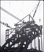 Workers building the Tyne Bridge