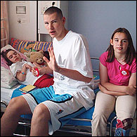 Jason with his twin sisters Hannah and Jannai, who has cerebral palsy