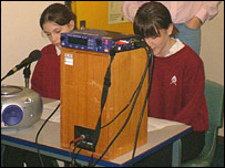 Pupils reading the news