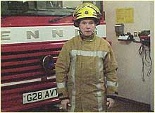 Sub Officer Steve Whitcut at Eccleshall Fire Station on duty in uniform.