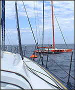 Loick Peyron rescues Vincent Riou in mid-Atlantic