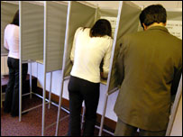 Voters in polling booths on election day
