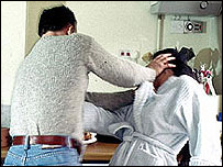 A man hitting a woman