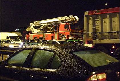 Fire engine being towed along the M5 by Farry