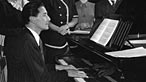 Ivor Novello playing the piano
