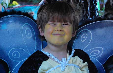 A boy dressed as a bumble bee.