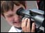 Boy using video camera