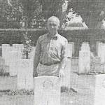 Gerald Bradley at his brothers grave in Normandy