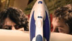 Gareth Aldon (Steve) and James Kristian (Tom) eye each other behind an iron and ironing board.