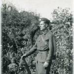 Dad in his Home Guard uniform, standing to attention, (but his trousers weren't!) This was taken in our back garden in Romford Essex in 1944.