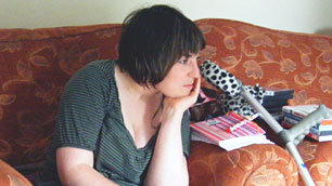 Nicola leans forward to concentrate hard on a movie - possibly a complicated plot-twist