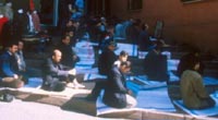 Muslims performing mid-day prayer to Mecca in the streets of Istanbul, Turkey