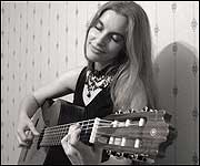 Rebecka playing her guitar
