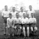 Photograph of George Lord aged 29 seated second from the left on the front row. The photograph was taken in February 1940 at Topson Barracks in Exeter, Devon, following a 10-mile cross-country run. George won the race coming home first out of 660 competitors and received a cash 1st prize of two shillings and six pence (12 ½ pence)