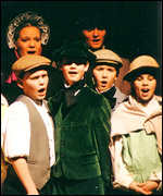 Sam Coulson as an urchin in 'Scrooge'