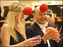 Musicians with whoopee cushions 