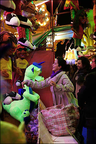 A woman chooses her prize at Goose Fair