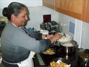 chef dishing up a curry meal