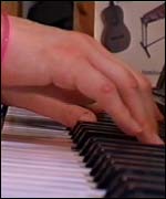 Nita plays piano