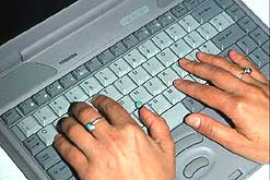 Image: Hands on laptop