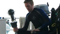 Philippe Cousteau holding the 360° camera.