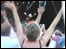 The crowd with their hand in the air