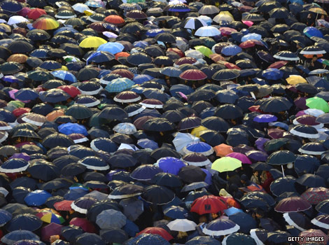 People under umbrellas outside the Vatican, Rome