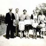 Sunday afternoon walk. Picture taken on Gapsick Lane, Clowne. From left to right, adults are Mr Bend, Mr Beeston, Mrs Wignell, Mrs Beeston, and Mrs Bend. Children are: Hilary Wignell, Ronnie Bend, Ezra and Sylvia Bend.