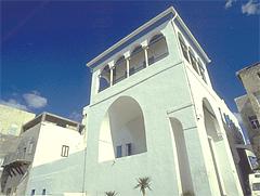 Bahá'u'lláh's house, a white building with wide archways