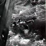 Herbert helping to rescue two shipwrecked refugees