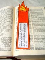 Bible with a bookmark shaped like a pillar of fire (depicting the image of the Holy Spirit in the story)
