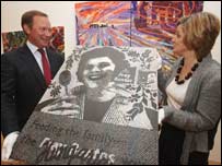 Coun John Procter and Moira Innes examine the artwork