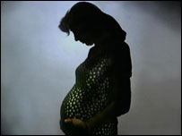A pregnant woman in silhouette